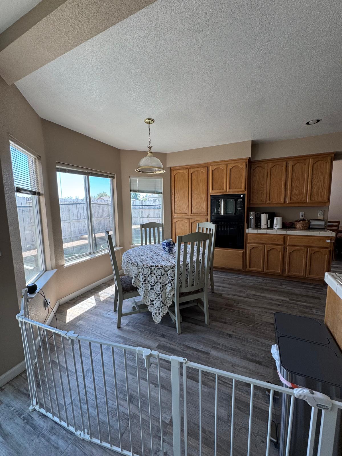 Bright dining nook with a wooden table, ideal for shared meals