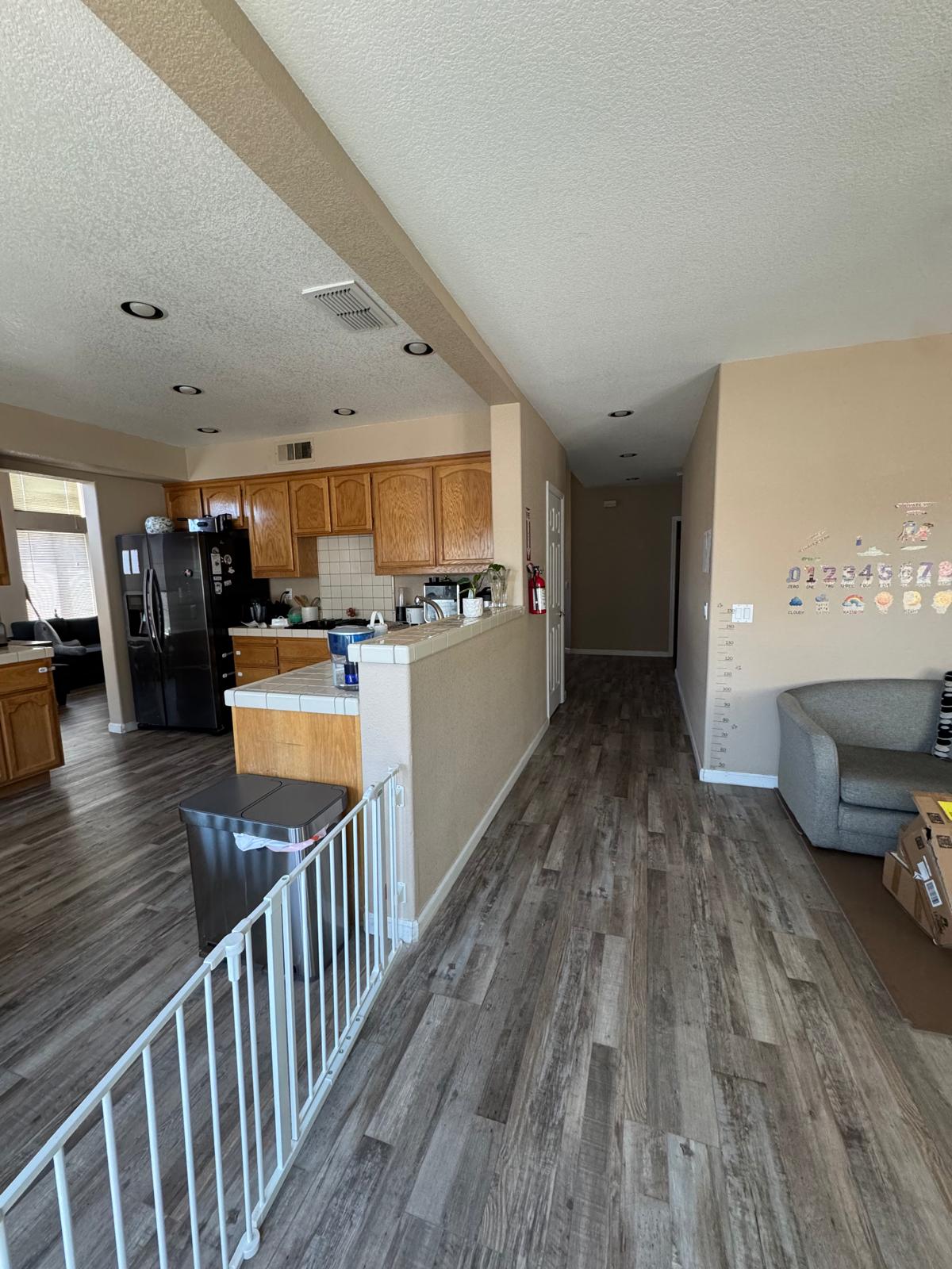 Open kitchen and living area with a safety gate for a secure environment